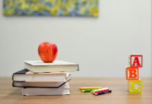 books with an apple and blocks
